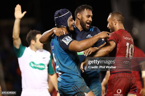 Gerard Cowley-Tuioti of the Blues celebrates his try with Patrick Tuipulotu during the round 15 Super Rugby match between the Blues and the Reds at...