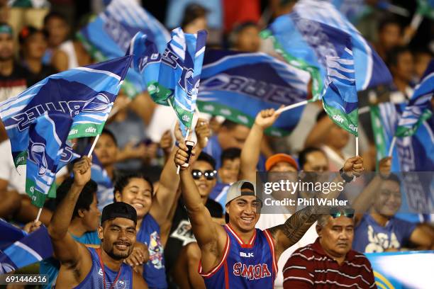 Locals show their support for the Blues during the round 15 Super Rugby match between the Blues and the Reds at Apia Park National Stadium on June 2,...