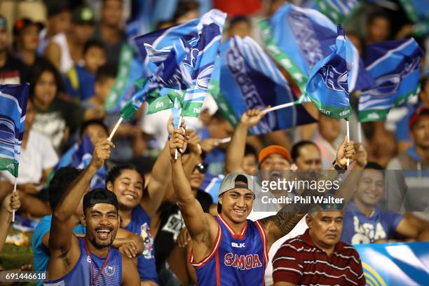 Locals show their support for the Blues during the round 15 Super Rugby match between the Blues and the Reds at Apia Park National Stadium on June 2,...