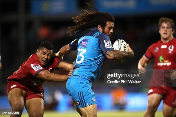 Rene Ranger of the Blues heads in for a try during the round 15 Super Rugby match between the Blues and the Reds at Apia Park National Stadium on...