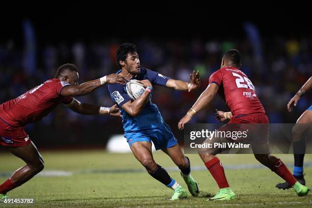 Melani Nanai of the Blues is tackled during the round 15 Super Rugby match between the Blues and the Reds at Apia Park National Stadium on June 2,...
