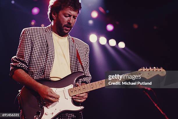 English guitarist Eric Clapton performing on stage at The Prince's Trust all-star Rock Gala at Wembley Arena, London, 5th June 1987.