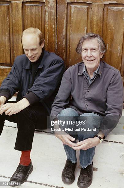 English musician, composer and record producer Brian Eno with American avant-garde composer and writer John Cage , May 1985.