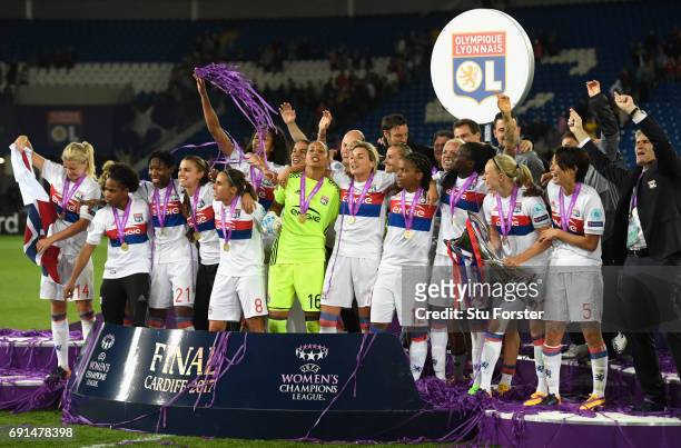 Olympique Lyonnais celebrate with the trophy after the UEFA Women's Champions League Final between Lyon and Paris Saint Germain at Cardiff City...