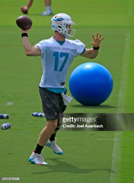 Ryan Tannehill of the Miami Dolphins throws the ball during the teams OTA's on May 31, 2017 at the Miami Dolphins training facility in Davie, Florida.