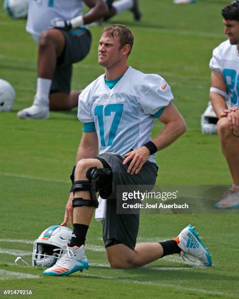 Ryan Tannehill of the Miami Dolphins stretches during the teams OTA's on May 31, 2017 at the Miami Dolphins training facility in Davie, Florida.