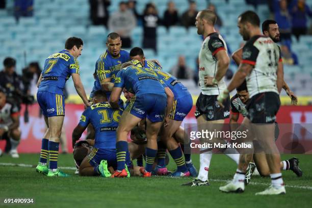 Clinton Gutherson of the Eels celebrates with his team mates after scoring a try during the round 13 NRL match between the Parramatta Eels and the...