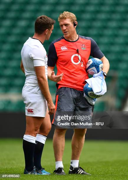 George Ford of England talks with Sam Vesty, Skills Coach of England during a training session at Twickenham Stadium on June 2, 2017 in London,...