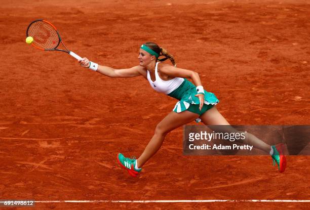 Kristina Mladenovic of France plays a forehand during ladies singles third round match against Shelby Rogers of The United States on day six of the...