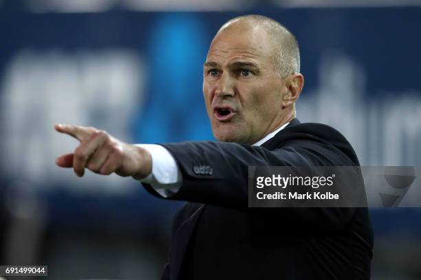 Eels coach Brad Arthur shouts as he watches on from the bench during the round 13 NRL match between the Parramatta Eels and the New Zealand Warriors...