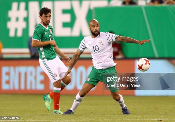 David McGoldrick of Ierland and Oswaldo Alanis of Mexico compete for the ball during the friendly match between the Republic of Ireland and Mexico at...