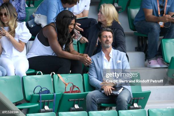 Serena Williams, pregnant, and French coach Patrick Mouratoglou attend Venus Williams match during the 2017 French Tennis Open - Day Four at Roland...