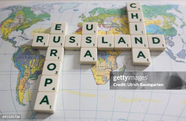 Symbol photo on the topics world policy, world trade, world economy, etc. The photo shows the words Russia, Europe, USA and China, composed of...