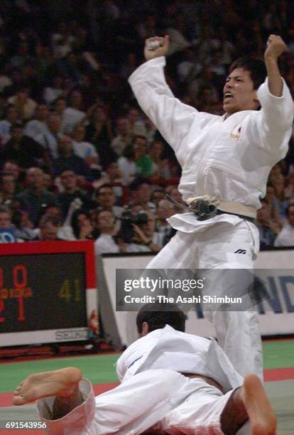 Tadahiro Nomura of Japan celebrates winning the gold medal after the Men's -60kg final against Georgi Revazichvili of Georgia during the World Judo...