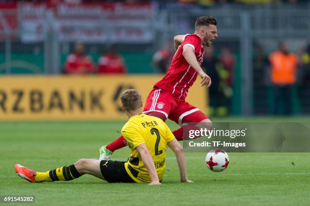 Amos Pieper of Dortmund and Manuel Wintzheimer of Munich battle for the ball during the U19 German Championship Final match between U19 Borussia...