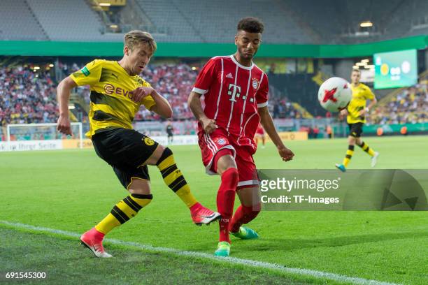 Felix Passlack of Dortmund and Timothy Tillman of Munich battle for the ball during the U19 German Championship Final match between U19 Borussia...