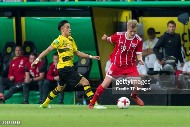 Hueseyin Bulut of Dortmund and Felix Goetze of Munich battle for the ball during the U19 German Championship Final match between U19 Borussia...