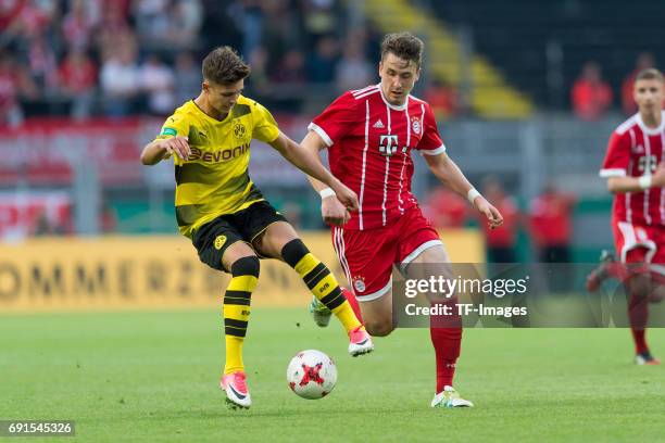 Alexander Laukart of Dortmund and Adrian Fein of Munich battle for the ball during the U19 German Championship Final match between U19 Borussia...