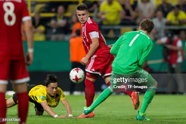 Hueseyin Bulut of Dortmund , Matthias Stingl of Munich and Goalkeeper Ron Thorben Hoffmann of Munich battle for the ball during the U19 German...