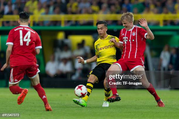 Hueseyin Bulut of Dortmund and Felix Goetze of Munich battle for the ball during the U19 German Championship Final match between U19 Borussia...