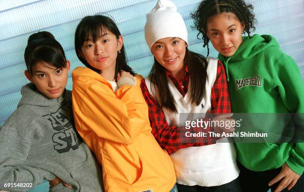 Takako Uehara, Hiroko Shimabukuro, Eriko Imai and Hitoe Arakaki of Japanese vocal/dance group SPEED pose for photographs on October 6, 1997 in Tokyo,...