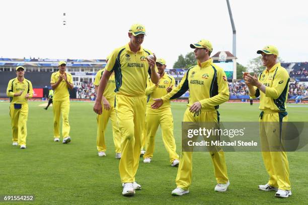 Josh Hazlewood of Australia is congratulated by captain Steve Smith after finishing with match figures of 6 for 52 during the ICC Champions Trophy...