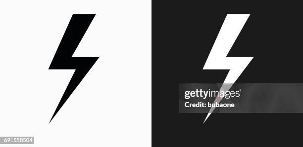 lightning bolt icon on black and white vector backgrounds - lightening bolt stock illustrations