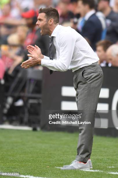 Head coach Ben Olsen of DC United looks on during a MLS Soccer game against the Chicago Fire at RFK Stadium on May 20, 2017 in Washington, DC. The...