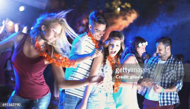 friends dancing at a party. - dance contest stock pictures, royalty-free photos & images