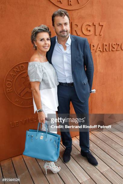 Henri Leconte and his wife Maria Dowlatshahi attend the 2017 French Tennis Open - Day Six at Roland Garros at Roland Garros on June 2, 2017 in Paris,...
