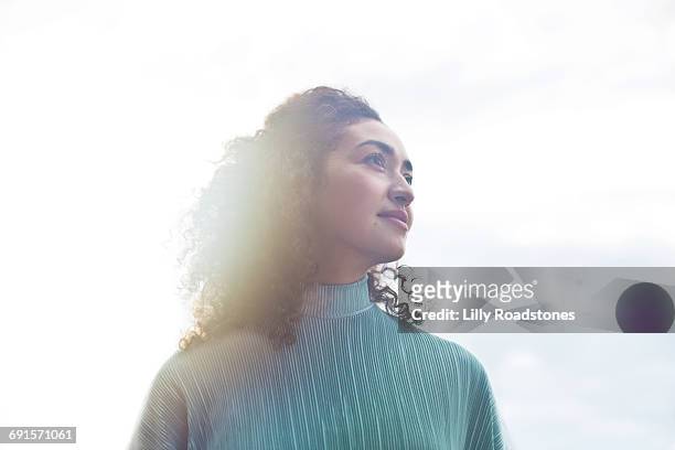 young woman looking into distance - day dreaming stock pictures, royalty-free photos & images