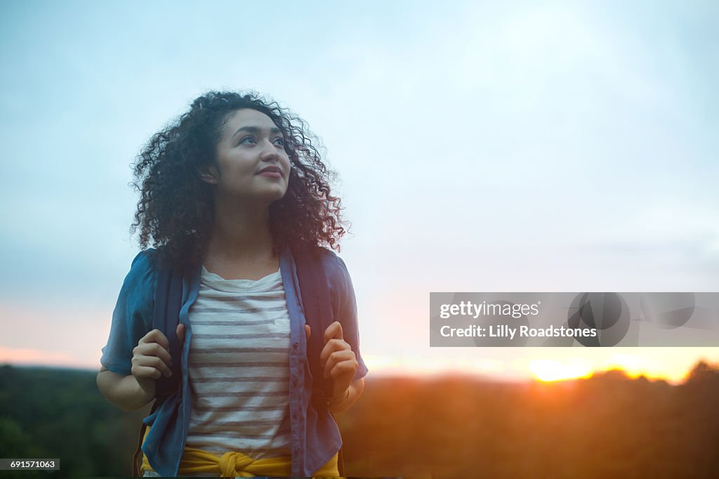 Young woman hiking at dawn