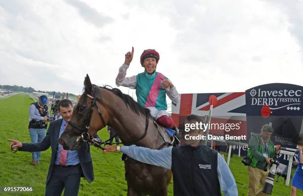 Frankie Dettori, riding Enable, celebrates winning the Investec Oaks race during Ladies Day of the 2017 Investec Derby Festival at The Jockey Club's...