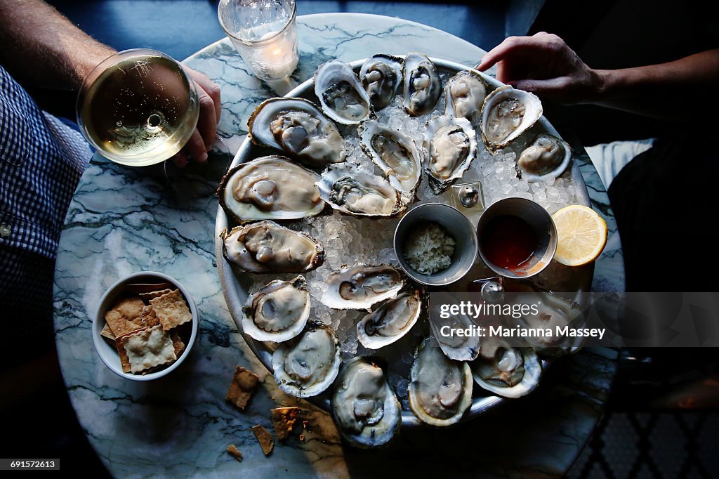 A couple enjoying raw oysters
