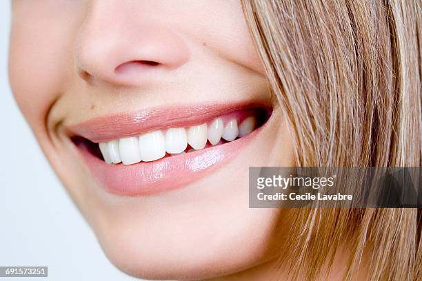 woman's smile, close-up - human teeth fotografías e imágenes de stock