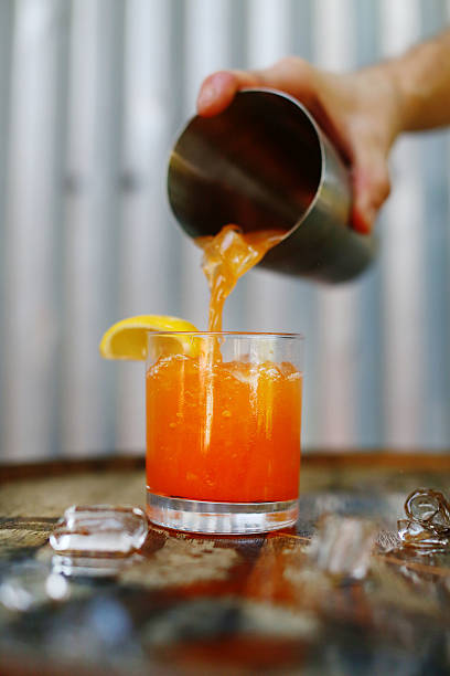 fresh cocktails - orange cocktail stock pictures, royalty-free photos & images