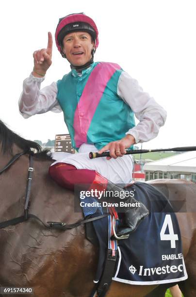 Frankie Dettori, riding Enable, celebrates winning the Investec Oaks race during Ladies Day of the 2017 Investec Derby Festival at The Jockey Club's...