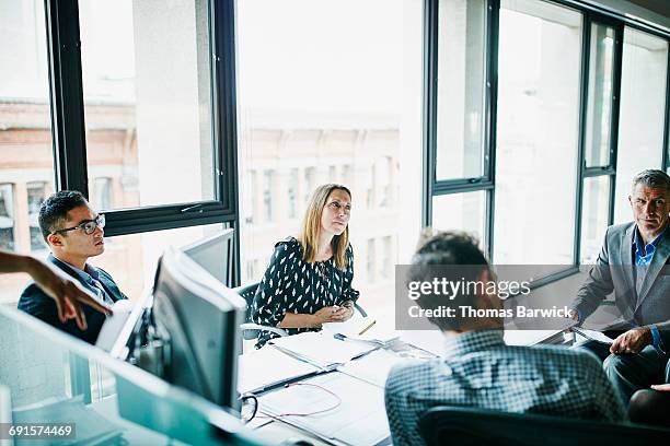 businesswoman listening to project ideas - financial inclusion stock pictures, royalty-free photos & images