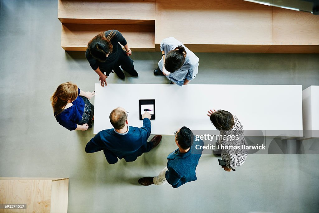 Business colleagues discussing project in office