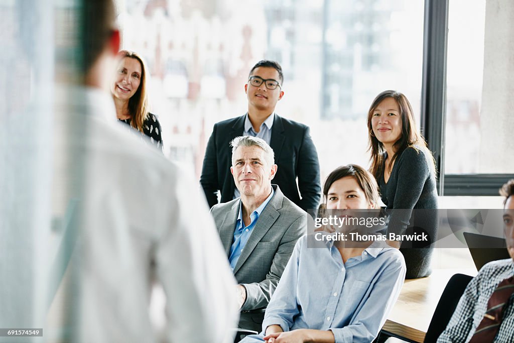 Businesspeople listening to project presentation