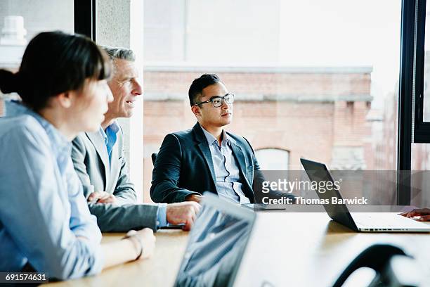 businessman listening to presentation - group people thinking stock pictures, royalty-free photos & images