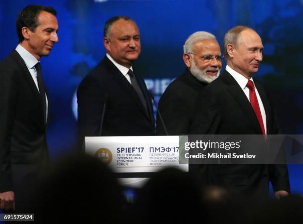 Russian President Vladimir Putin , Austrian Chancellor Christian Kern , Indian Prime Minister Narendra Modi and Moldovan President Igor Dodon arrive...