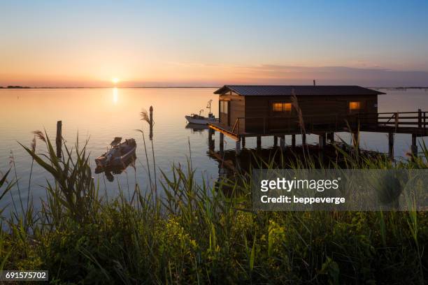 fishing shack - risorse sostenibili stock pictures, royalty-free photos & images