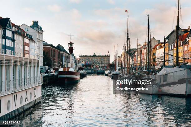view on the kongens nytorv and colorful houses in nyhavn in copenhagen, denmark - kongens nytorv stock pictures, royalty-free photos & images