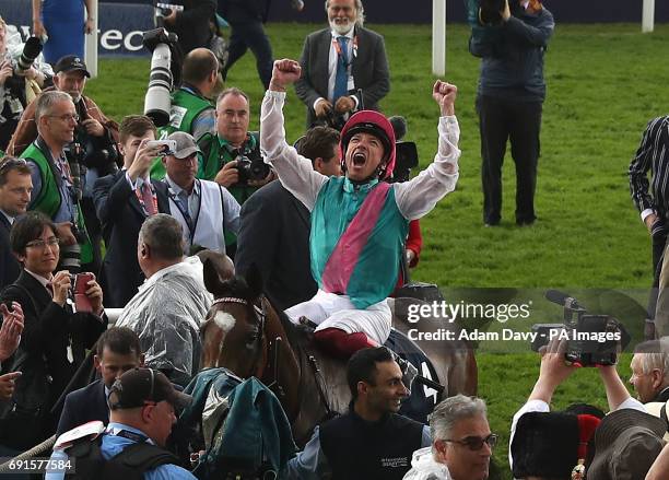 Jockey Frankie Dettori celebrates winning the Investec Oaks on Enable on Ladies Day during the 2017 Investec Epsom Derby Festival at Epsom...