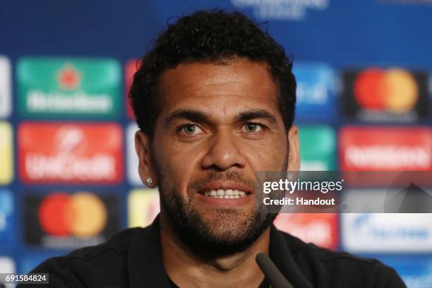 In this handout image provided by UEFA, Dani Alves of Juventus talks during a press conference prior to the UEFA Champions League Final between...