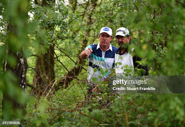 Scott Hend of Australia and caddie ponder a shot during the second round of The Nordea Masters at Barseback Golf & Country Club on June 2, 2017 in...