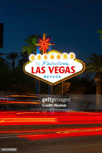 welcome to las vegas sign at night with motion blur - vegas sign stock pictures, royalty-free photos & images