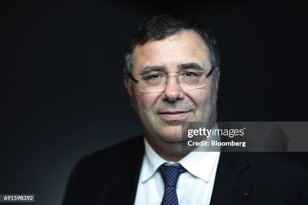 Patrick Pouyanne, chief executive officer of Total SA, poses for a photograph following a Bloomberg Television interview during the St. Petersburg...