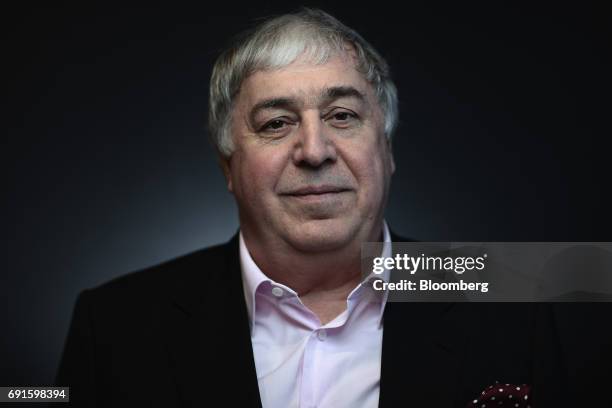 Mikhail Gutseriev, chairman of RussNeft OAO, poses for a photograph during the St. Petersburg International Economic Forum at the Expoforum in Saint...